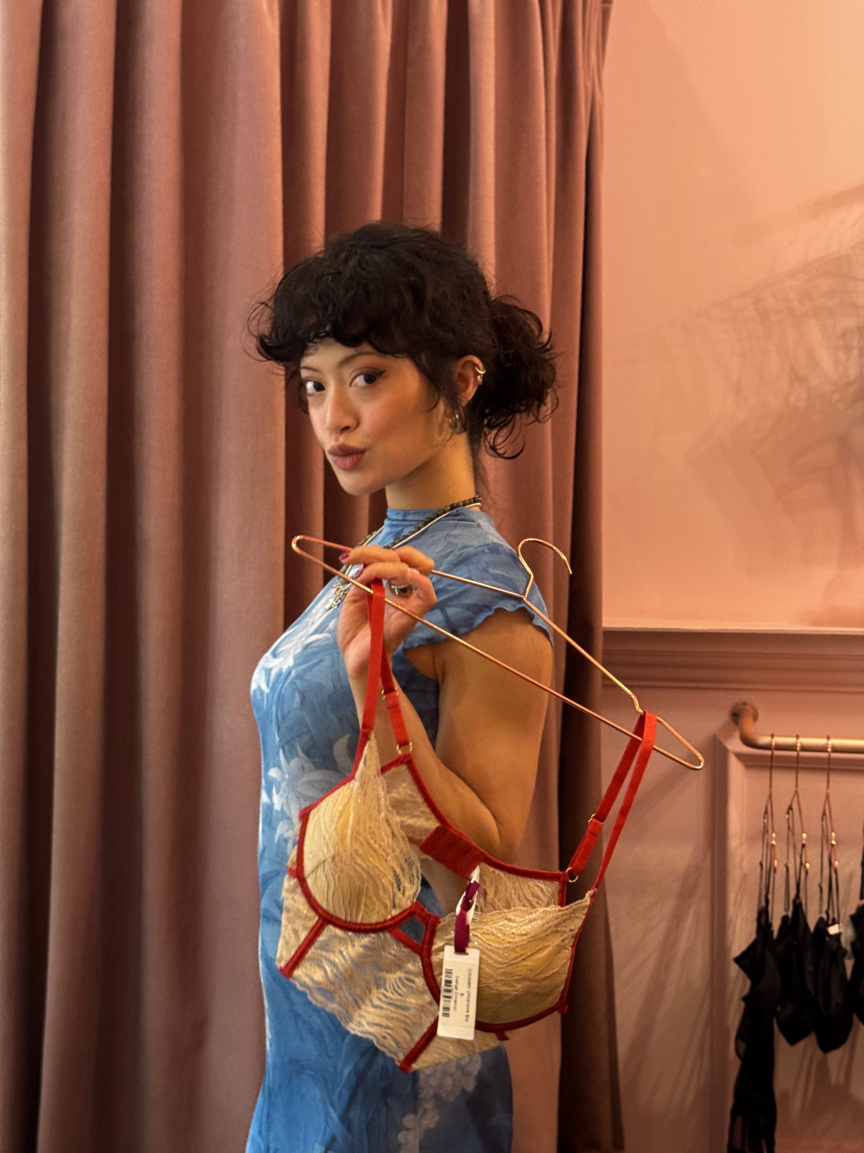 garbo zhu holding a bra